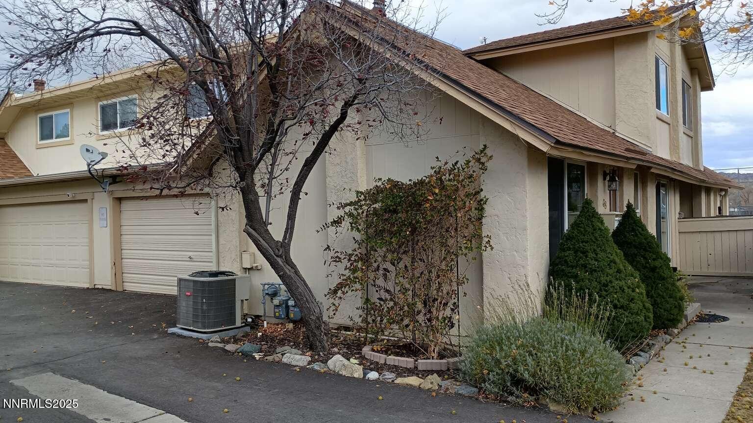 68 Condor Circle Carson City, NV 89701 - Photo 3 of 23 a view of a house with a tree