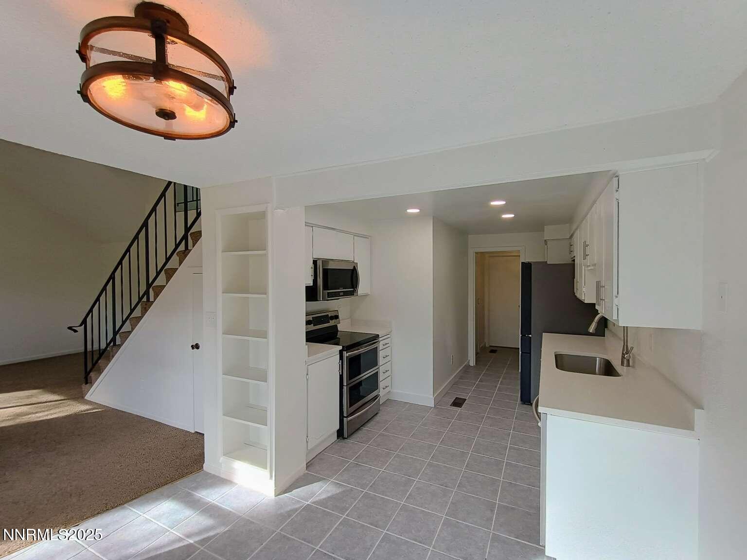 68 Condor Circle Carson City, NV 89701 - Photo 9 of 23 a view of a livingroom with furniture and entryway