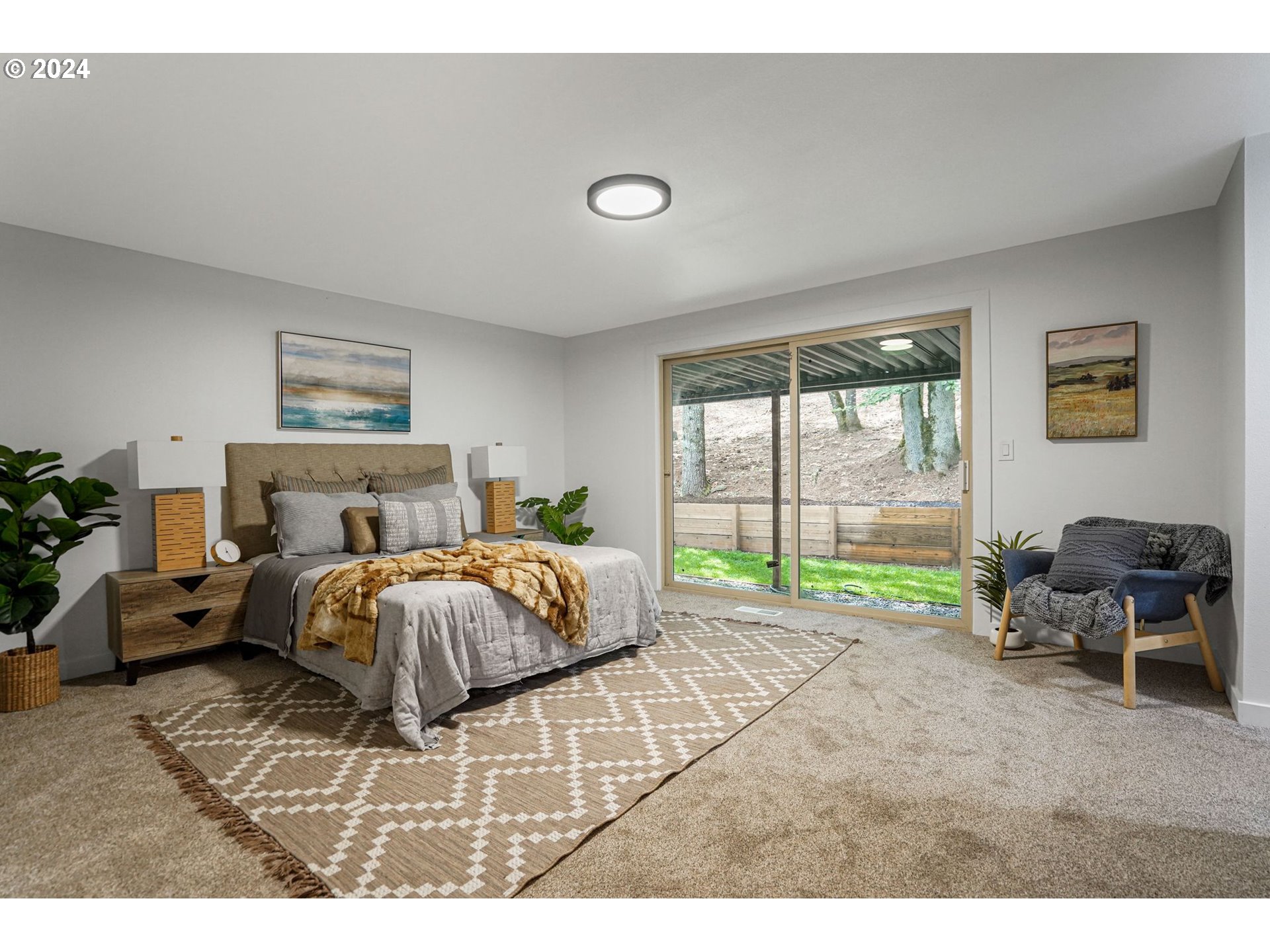 7565 Bates Road South Salem, OR 97306 - Photo 10 of 29 a spacious bedroom with a bed and a large window