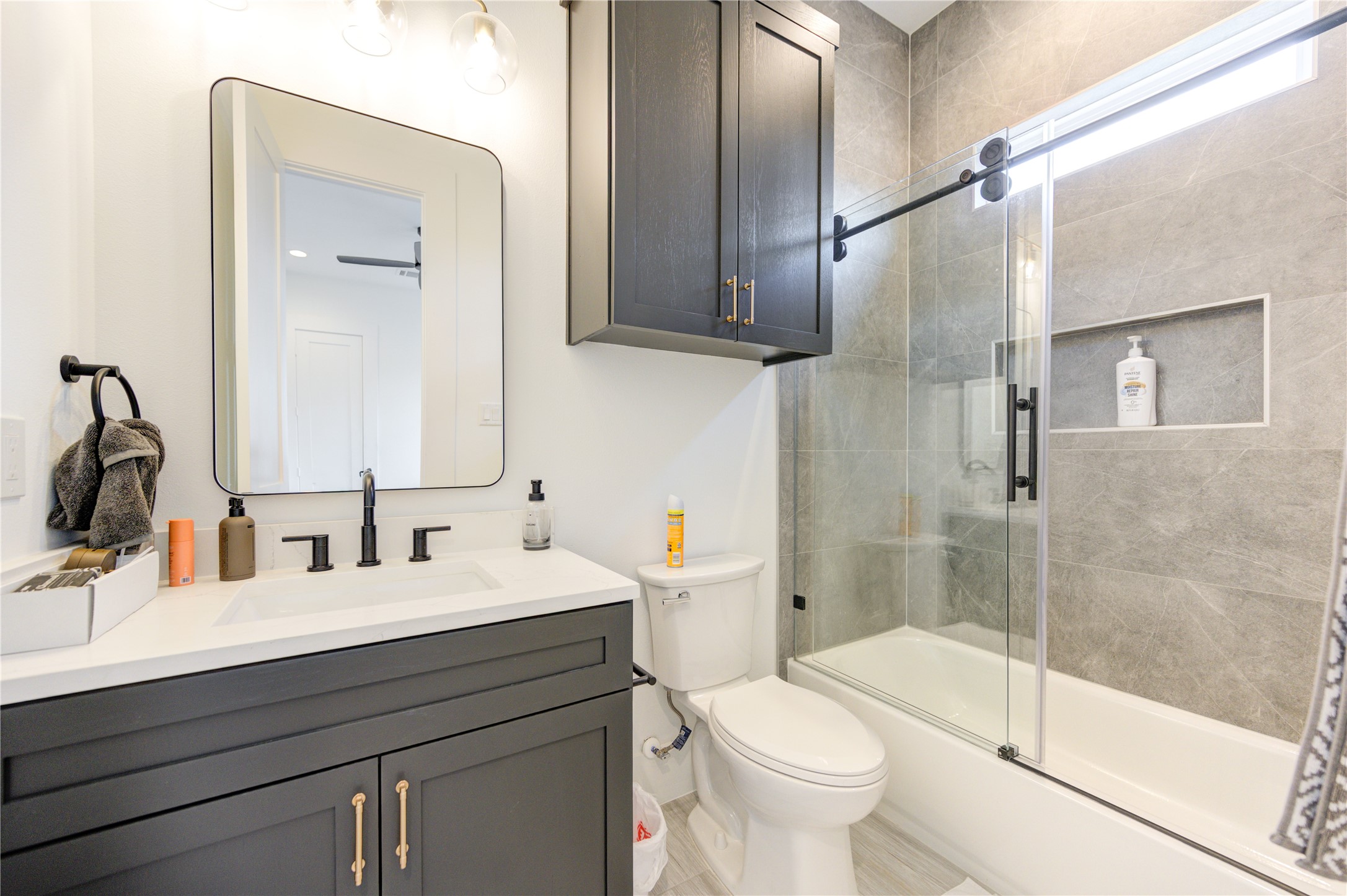 18 Sidney Street, Unit A Houston, TX 77003 - Photo 26 of 30 a bathroom with a sink and a mirror