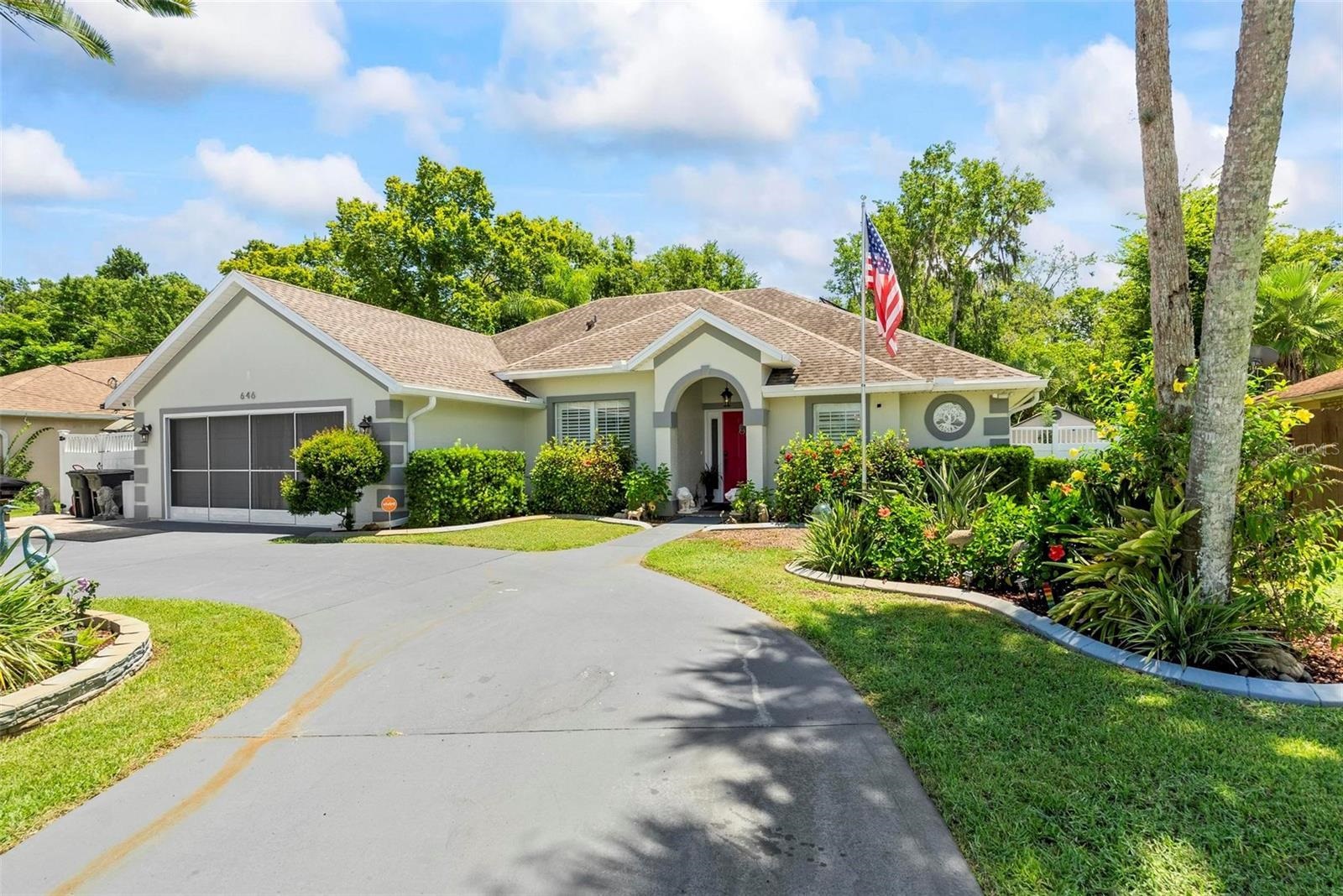 a front view of a house with swimming pool having outdoor seating