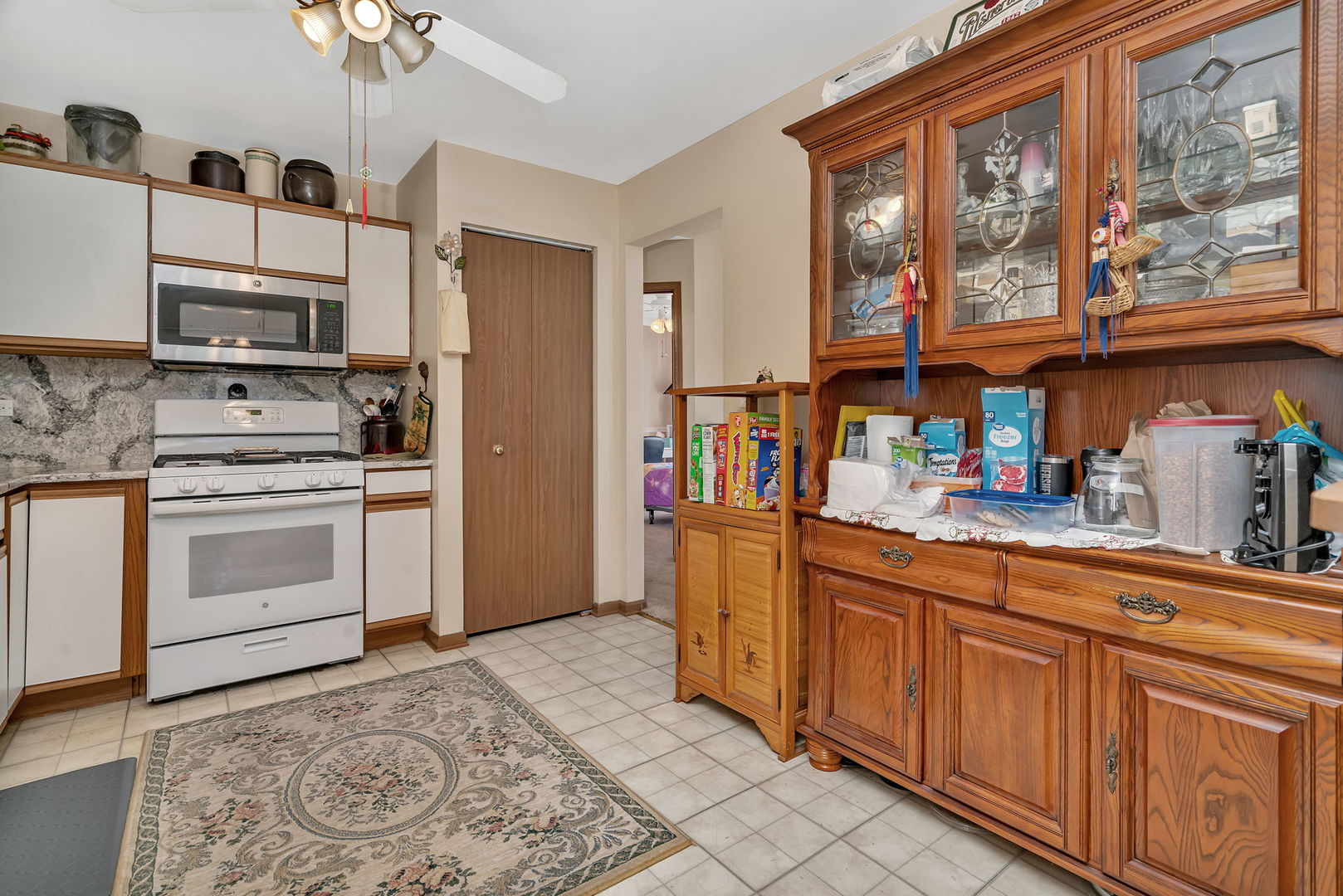 2750 Shelly Lane Aurora, IL 60504 - Photo 11 of 32 a kitchen with stainless steel appliances granite countertop a stove a sink and a refrigerator
