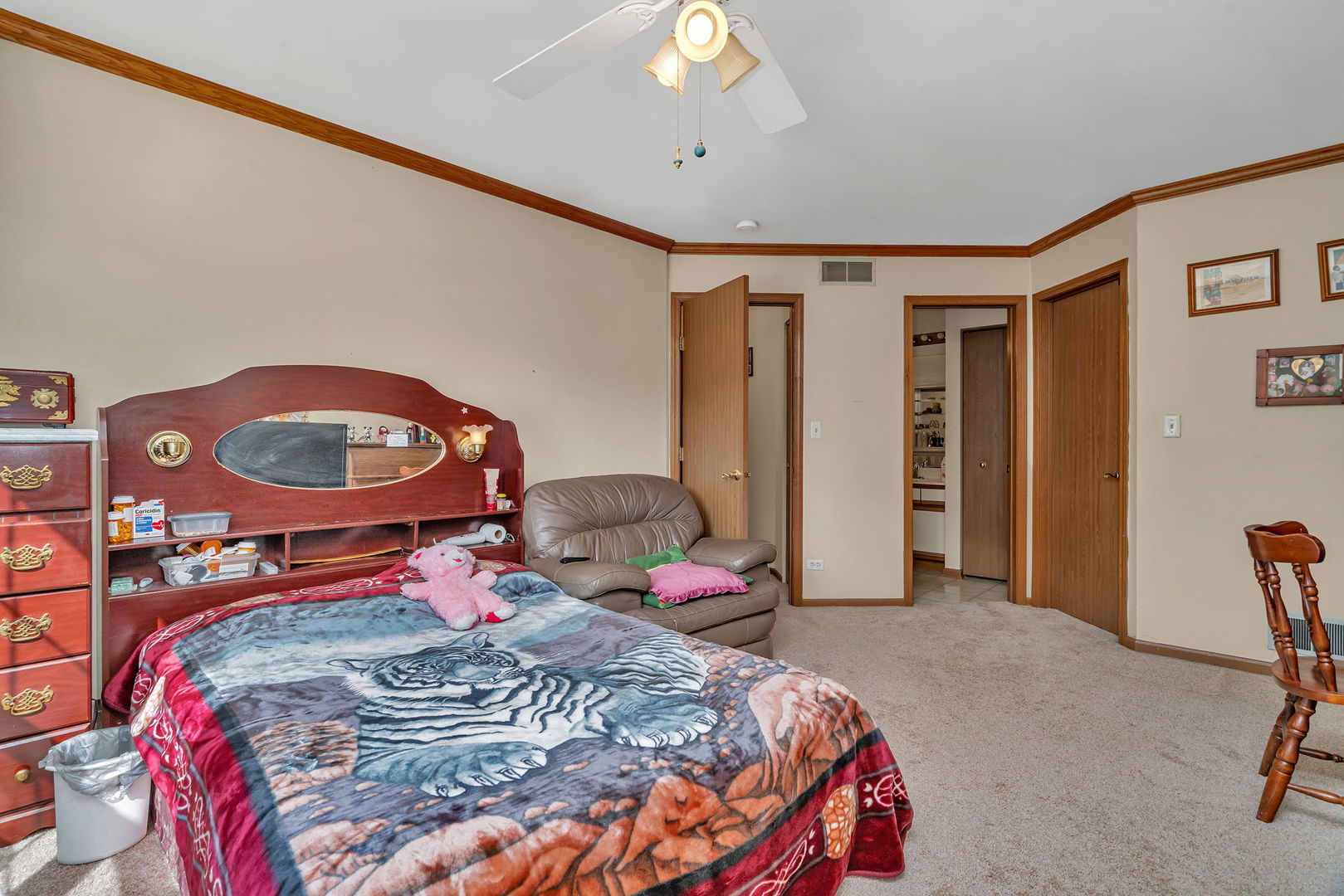 2750 Shelly Lane Aurora, IL 60504 - Photo 19 of 32 a bedroom with a bed a dresser and chair