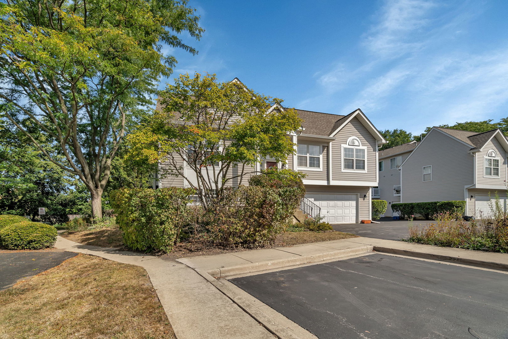 2750 Shelly Lane Aurora, IL 60504 - Photo 28 of 32 a front view of a house with a yard and garage