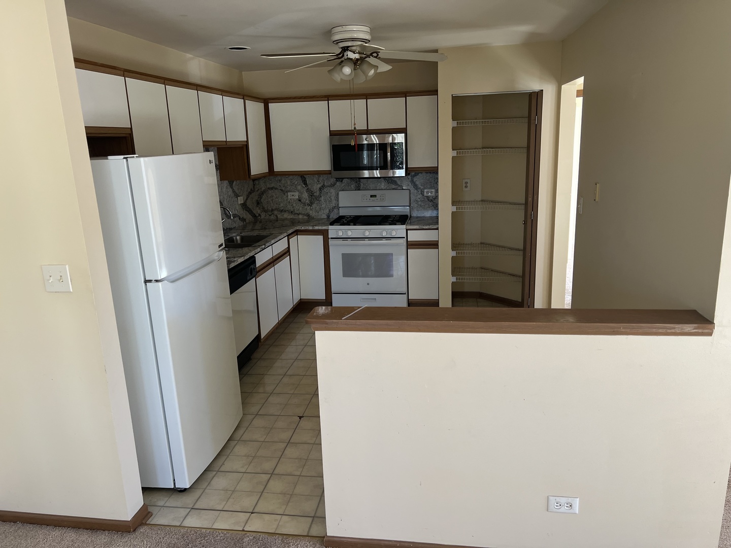 2750 Shelly Lane Aurora, IL 60504 - Photo 7 of 32 a kitchen with stainless steel appliances a refrigerator and a stove top oven