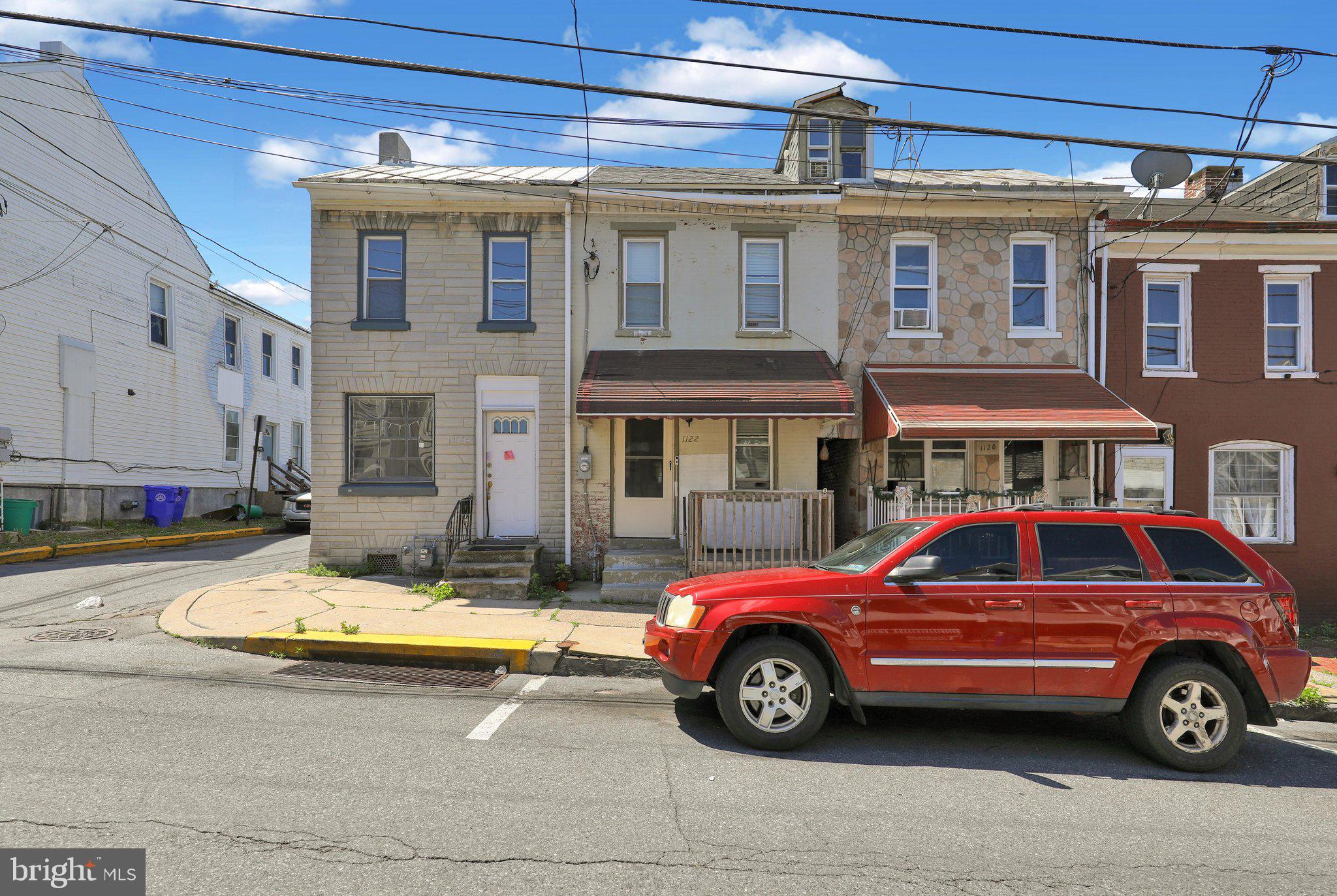 1122 Buttonwood Street Reading, PA 19604 - Photo 2 of 18 a car parked in front of a house