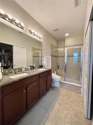 a view of a livingroom with workspace and a window