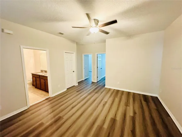 a view of a livingroom with wooden floor
