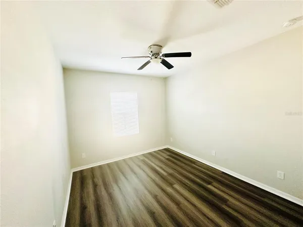 a view of room with a ceiling fan