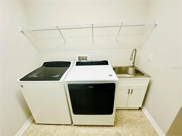 a view of room with window and ceiling fan