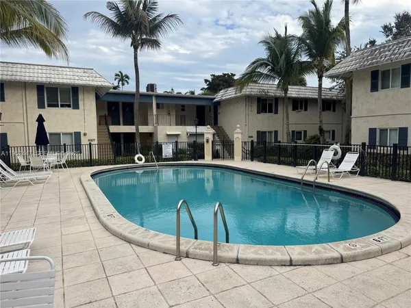 a view of a swimming pool with a patio