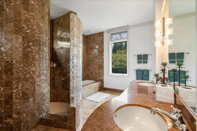 a living room with furniture and large windows