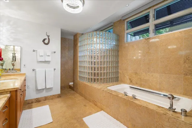 a spacious bathroom with a tub and a shower