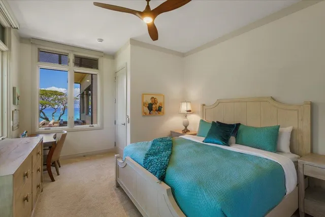 a bedroom with a bed a desk and chair