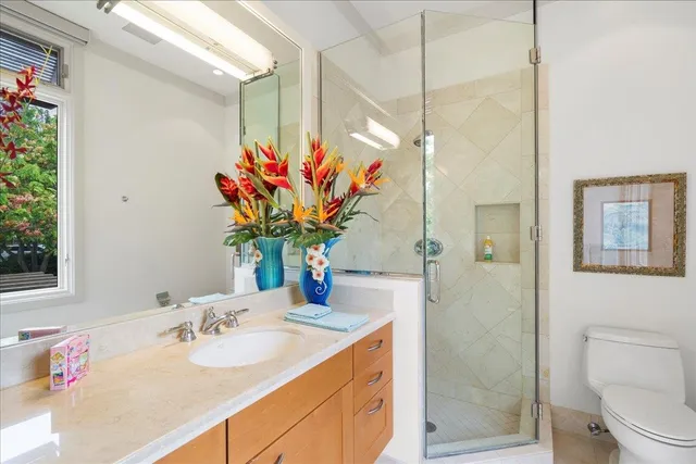 a bathroom with a sink a vanity and a mirror