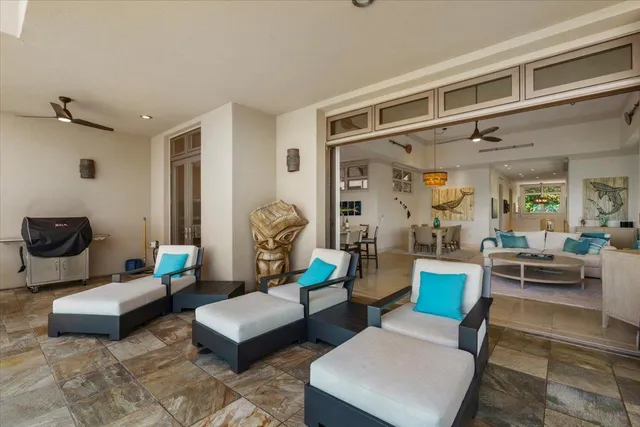 a living room with furniture and a rug