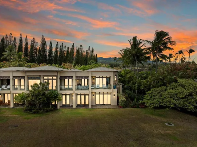 a view of a house with yard and a garden