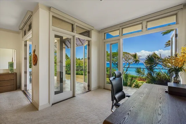 a view of living room with furniture and floor to ceiling window