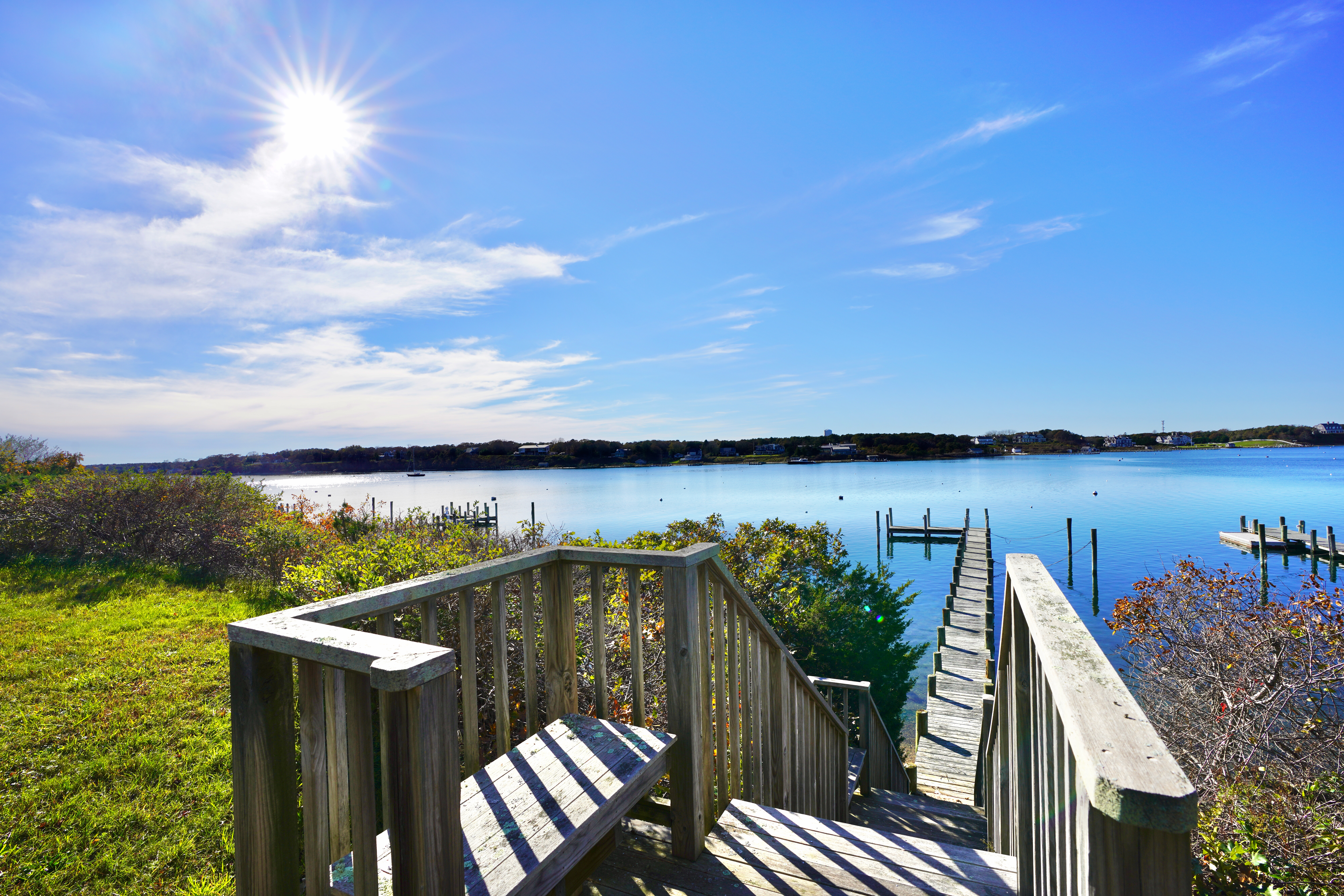 30 Calebs Pond Road Edgartown, MA 02539 - Photo 1 of 35 a view of a lake with a terrace