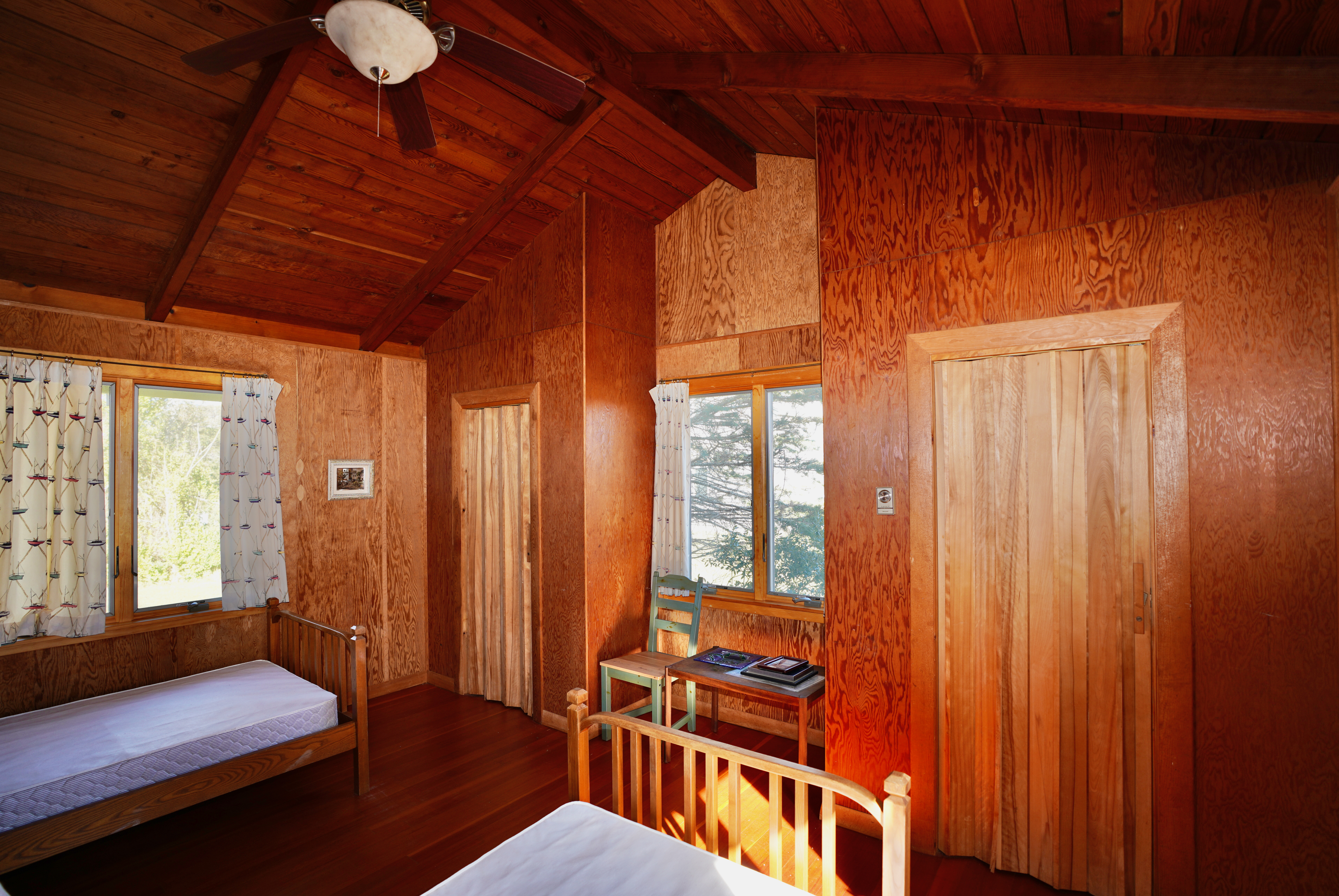 30 Calebs Pond Road Edgartown, MA 02539 - Photo 23 of 35 a bedroom with furniture and a window