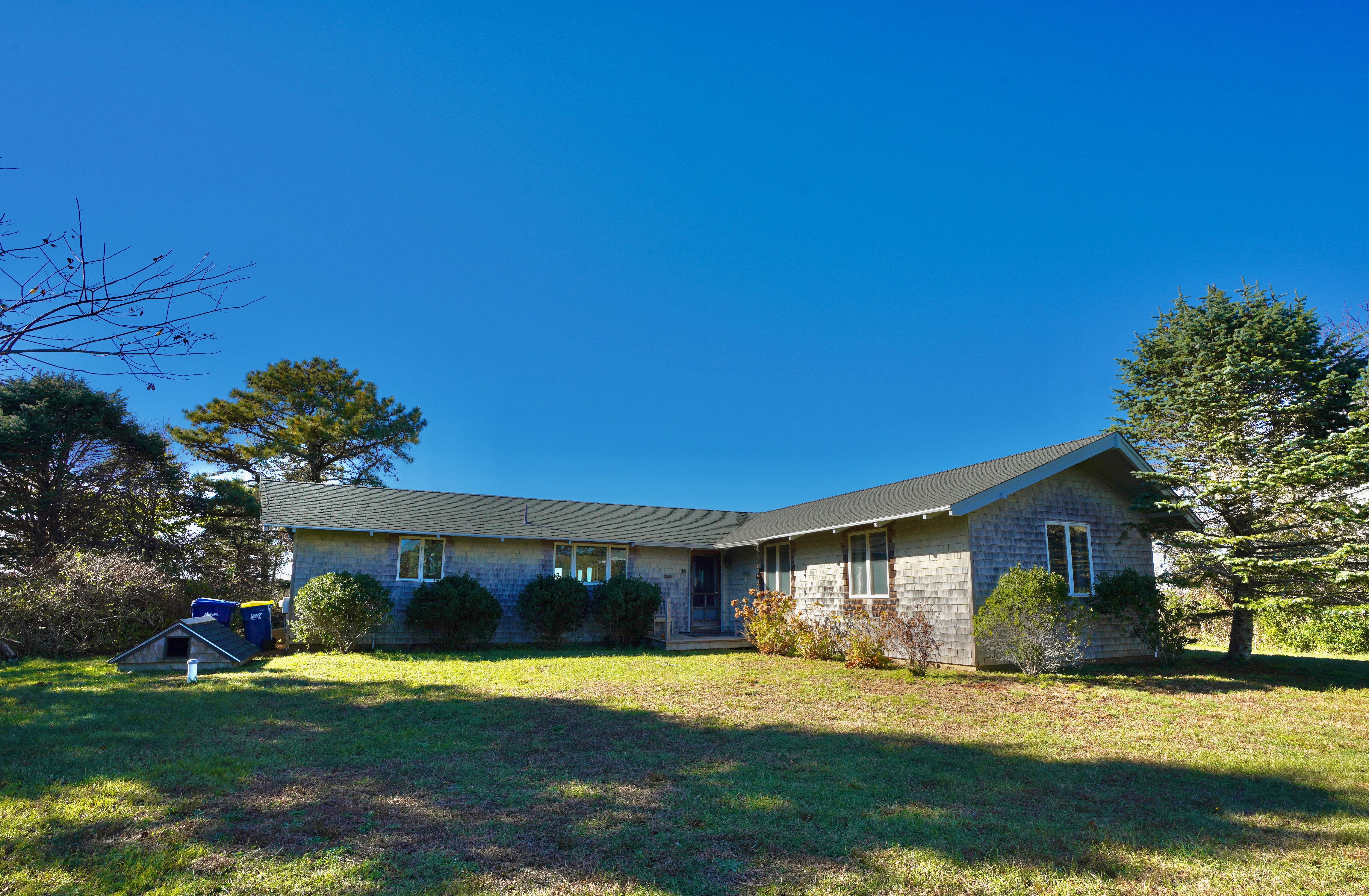30 Calebs Pond Road Edgartown, MA 02539 - Photo 24 of 35 a view of a house with a yard and garage