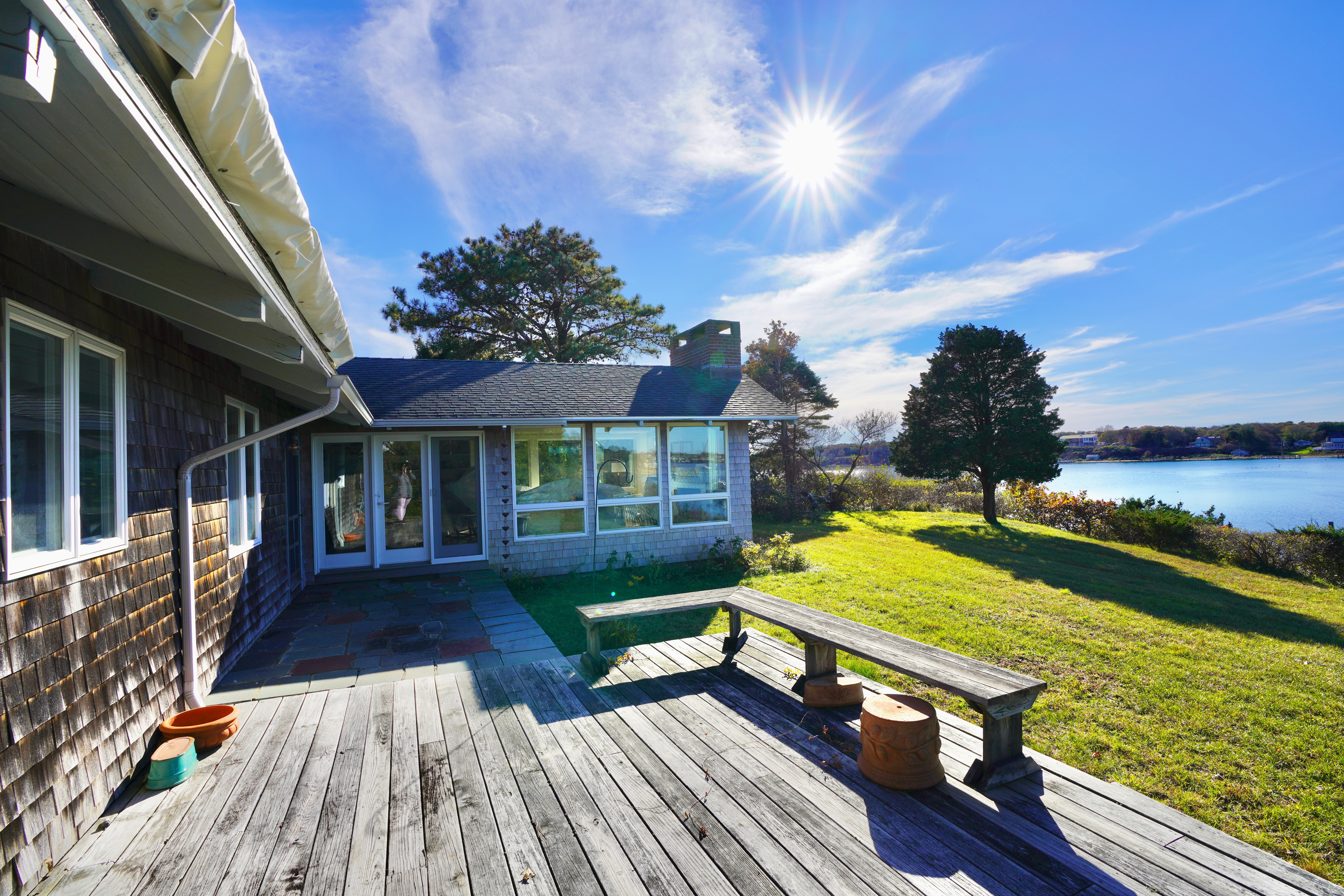 30 Calebs Pond Road Edgartown, MA 02539 - Photo 29 of 35 a view of a house with pool yard and outdoor seating