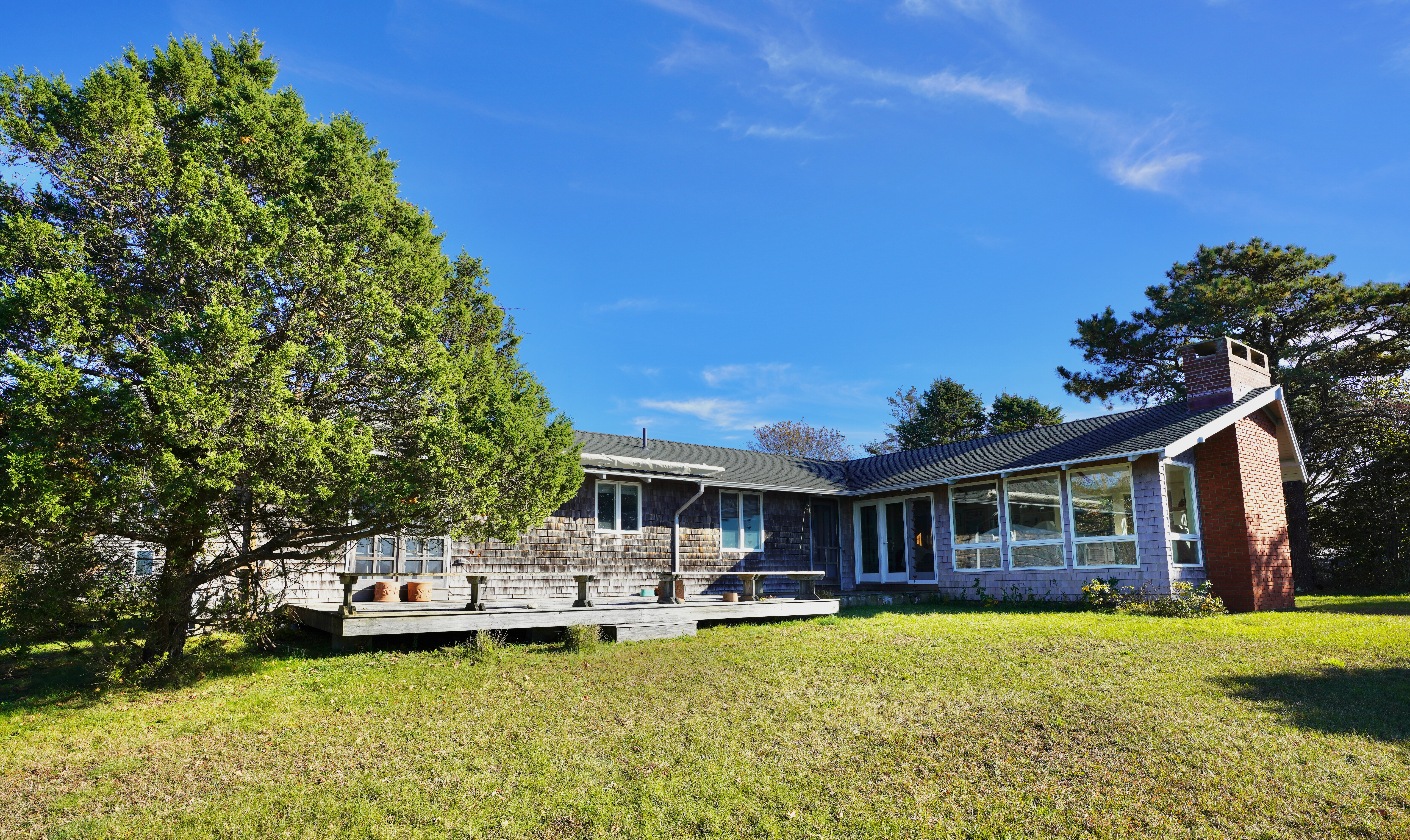 30 Calebs Pond Road Edgartown, MA 02539 - Photo 30 of 35 a view of a house with swimming pool and a yard