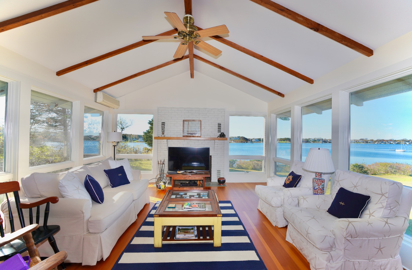 30 Calebs Pond Road Edgartown, MA 02539 - Photo 4 of 35 a living room with furniture fireplace and a flat screen tv