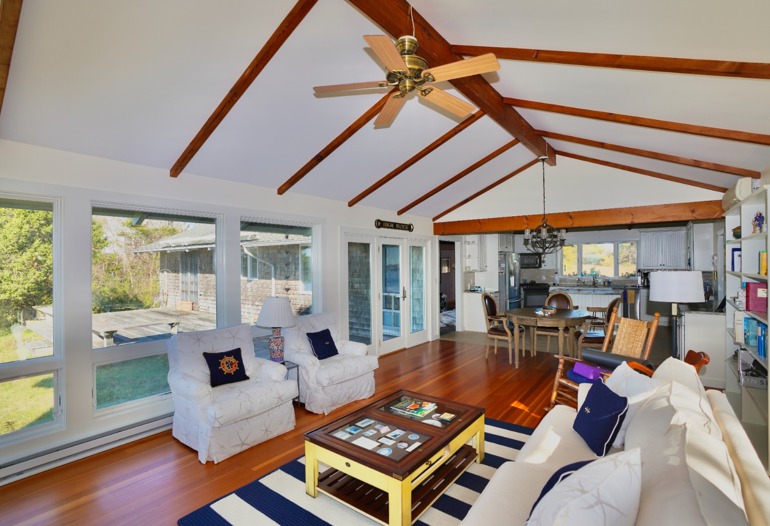 30 Calebs Pond Road Edgartown, MA 02539 - Photo 6 of 35 a living room with patio furniture and a floor to ceiling window