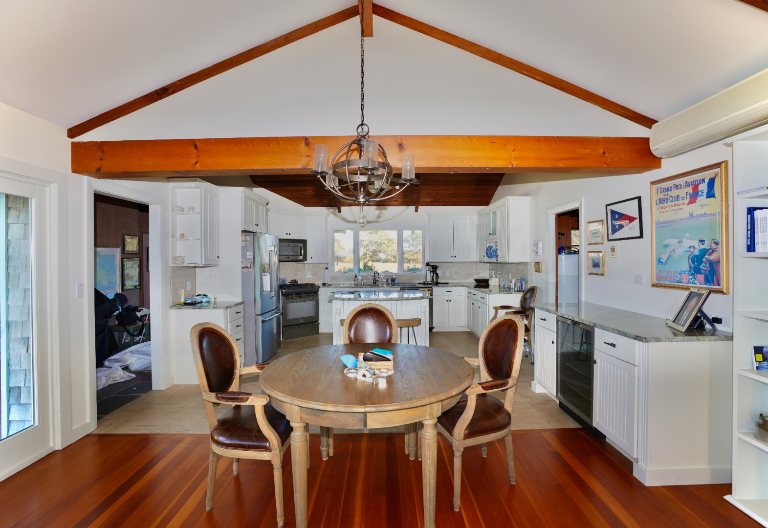 30 Calebs Pond Road Edgartown, MA 02539 - Photo 8 of 35 a dining room with furniture and a chandelier