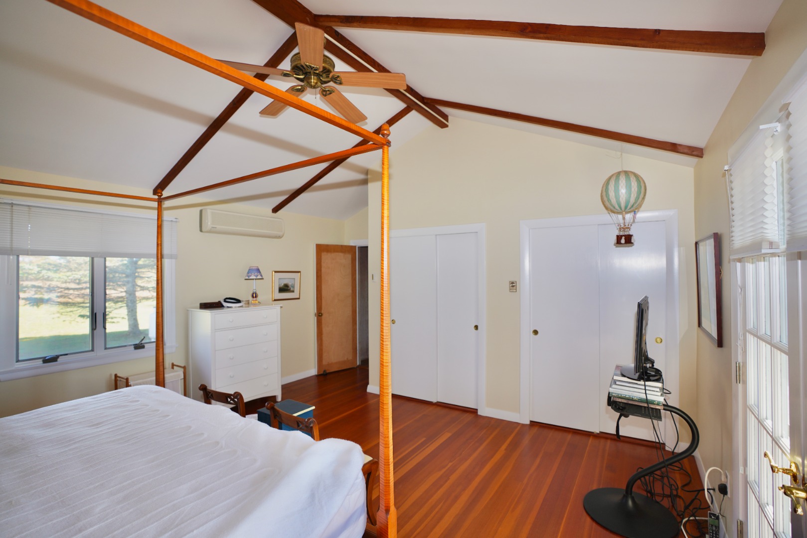 30 Calebs Pond Road Edgartown, MA 02539 - Photo 10 of 35 a bedroom with a bed and a wooden floor