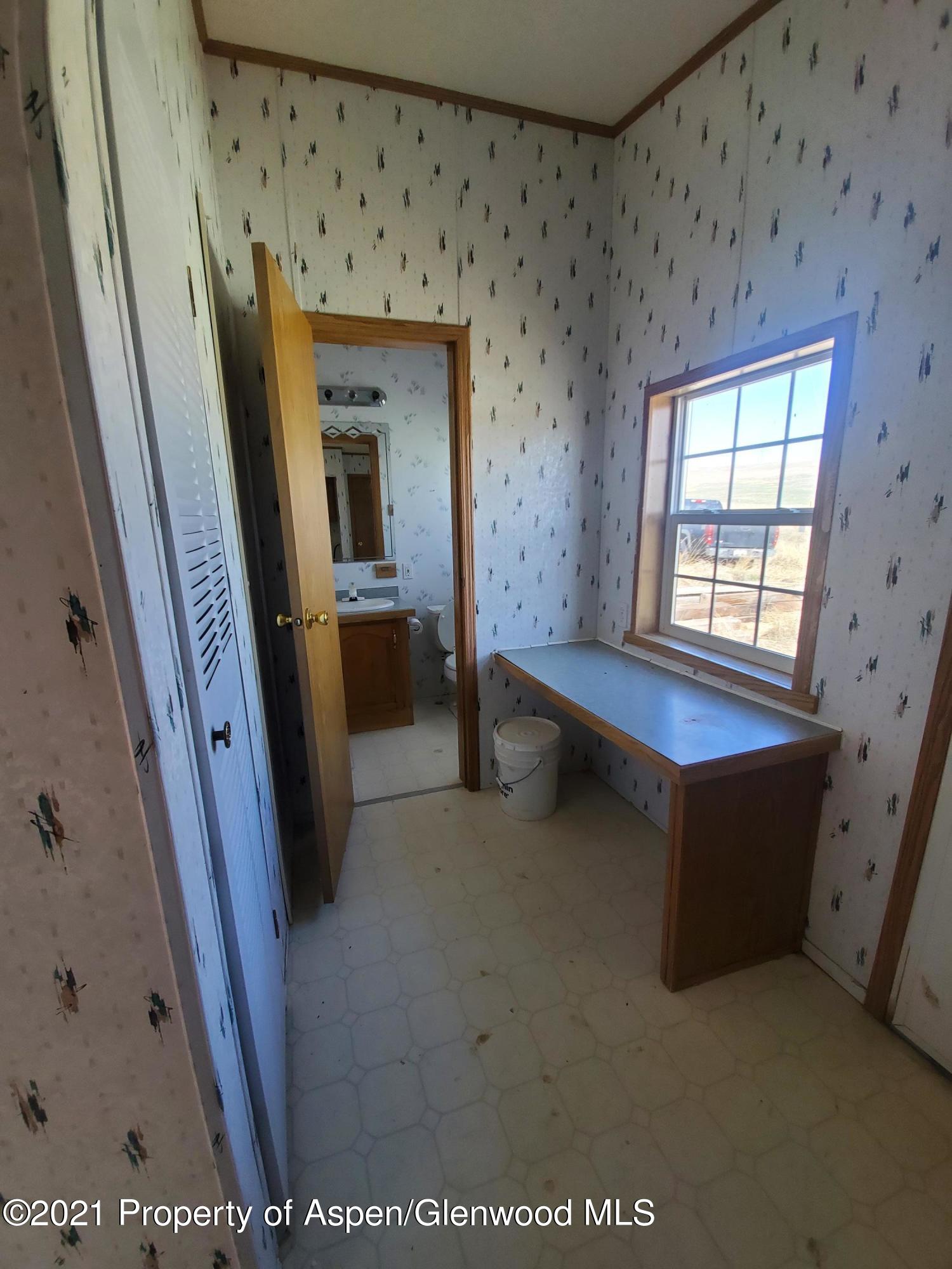 275 Roberts Road Craig, CO 81625 - Photo 15 of 16 a living room with furniture and a window