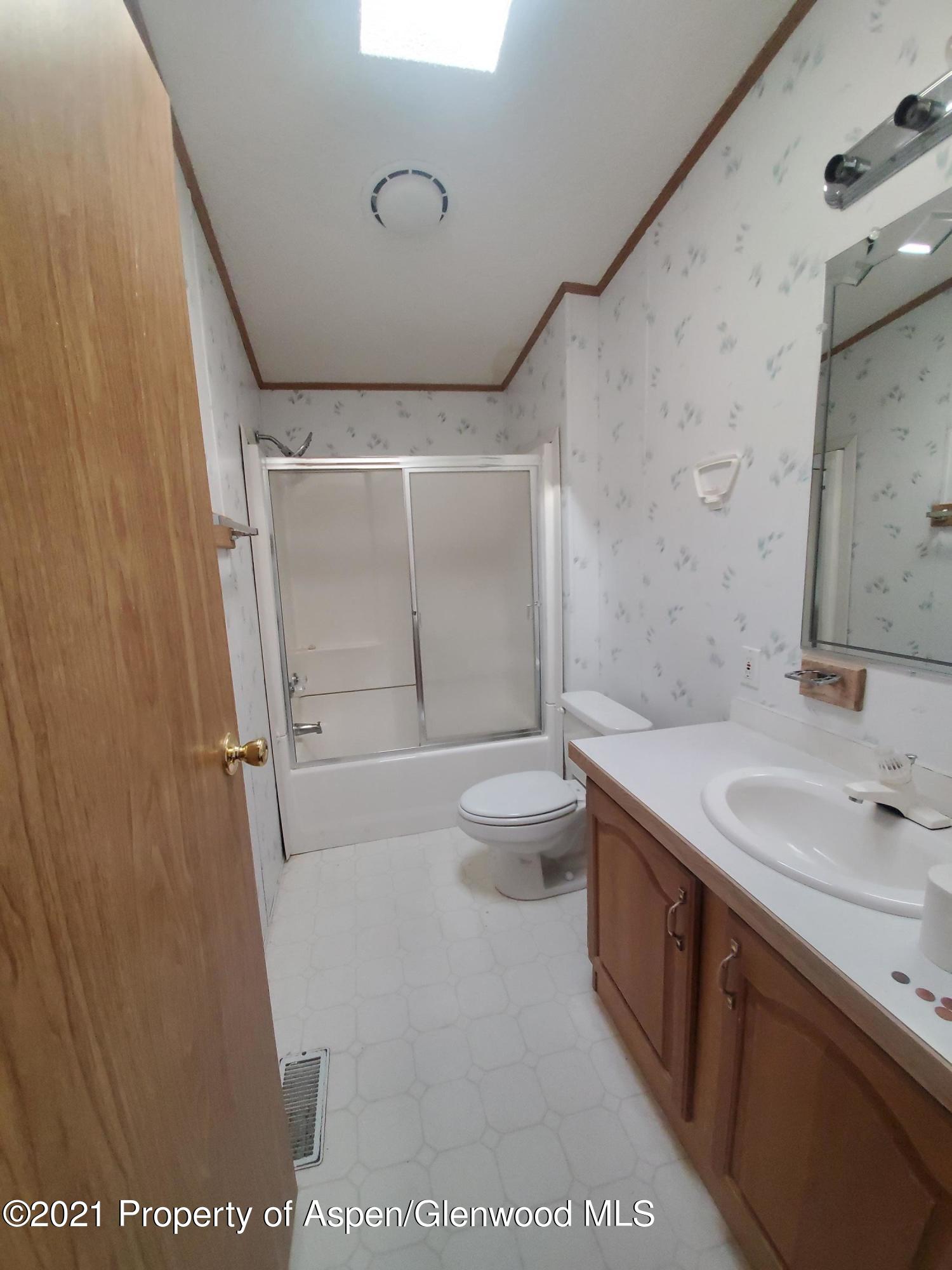 275 Roberts Road Craig, CO 81625 - Photo 16 of 16 a bathroom with a sink a toilet and shower