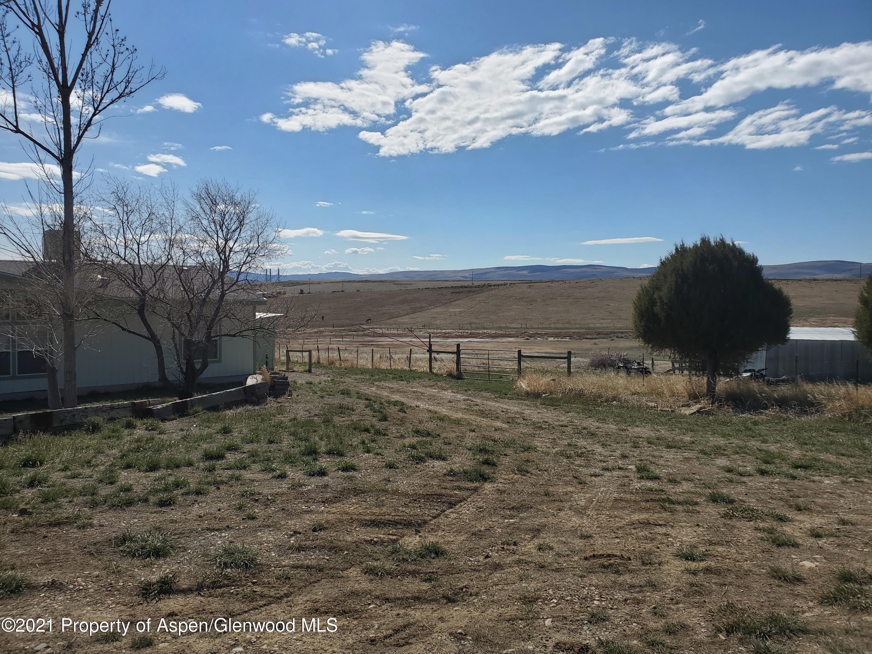 275 Roberts Road Craig, CO 81625 - Photo 2 of 16 a view of a backyard of the house