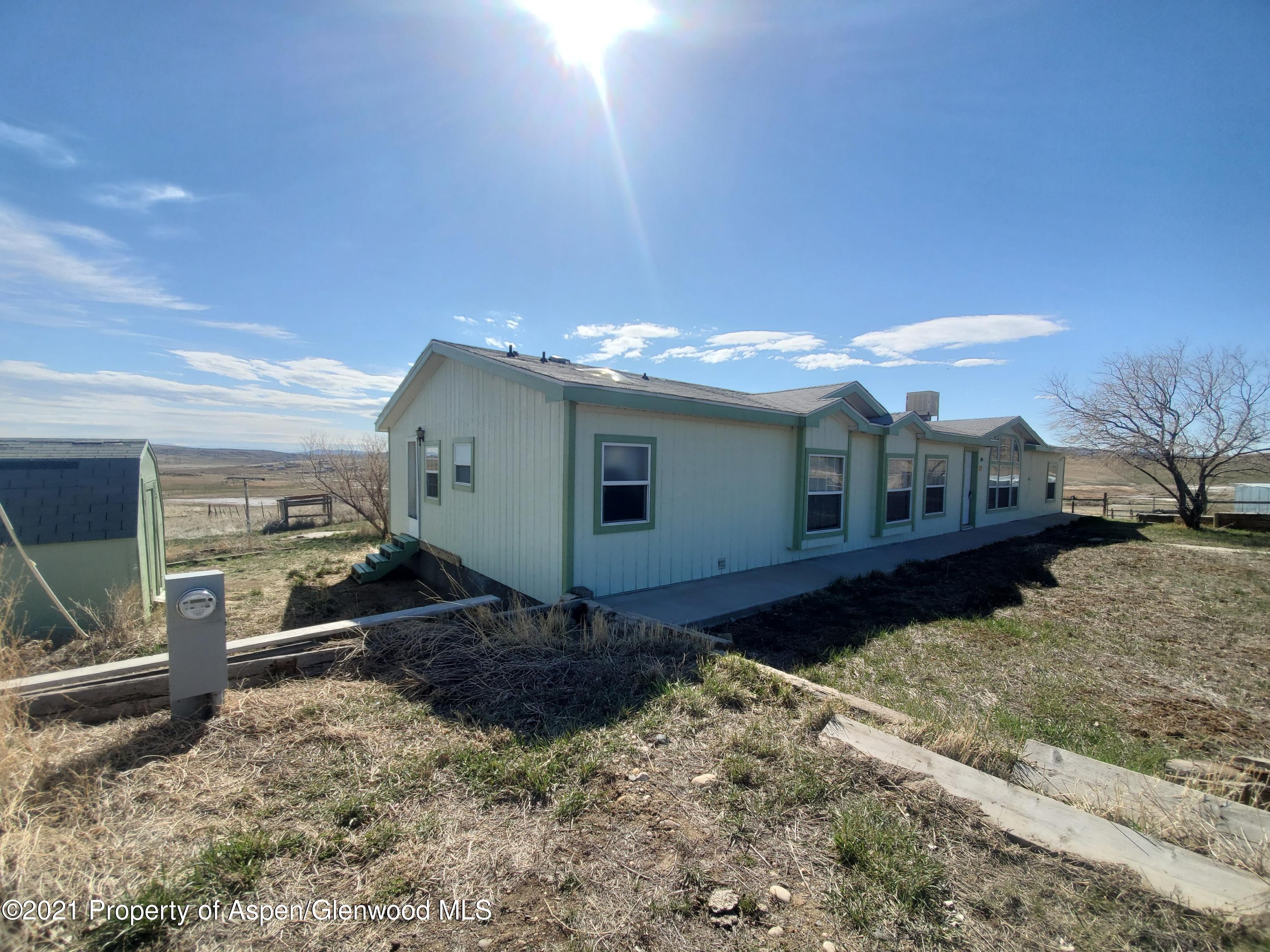 275 Roberts Road Craig, CO 81625 - Photo 5 of 16 a front view of a house with a yard