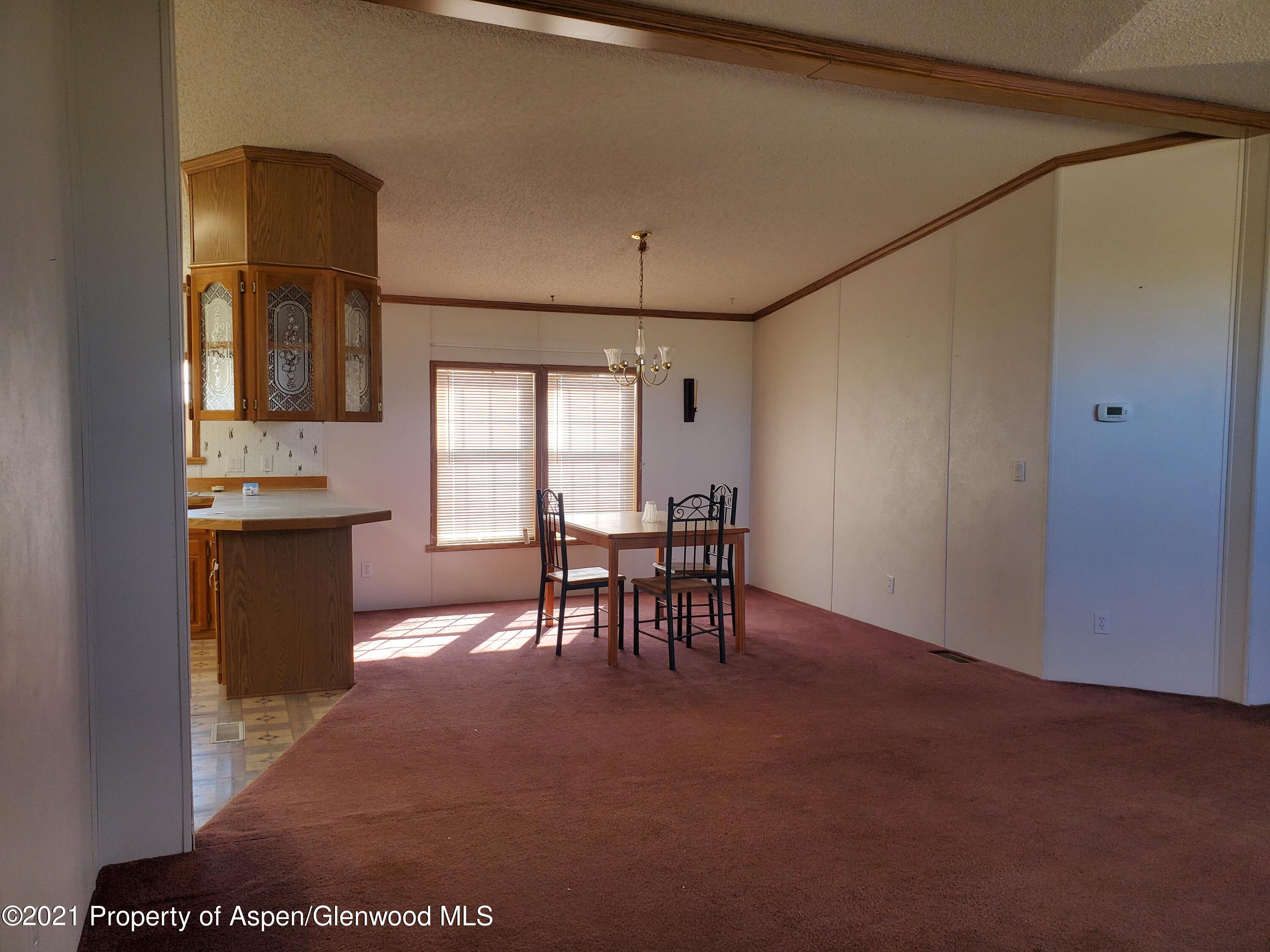 275 Roberts Road Craig, CO 81625 - Photo 7 of 16 a view of a dining room with furniture and window