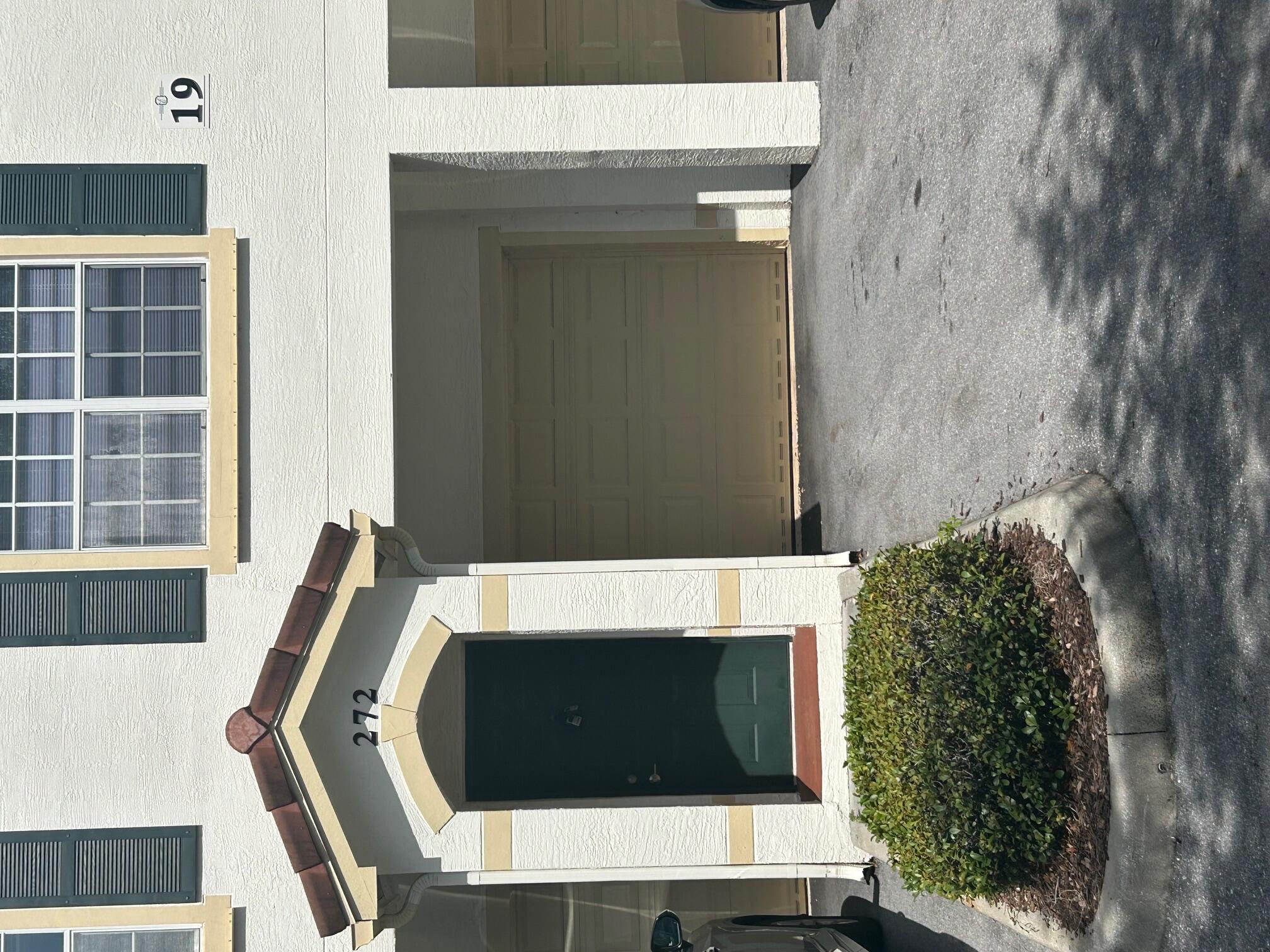 272 Southeast Kitching Circle Stuart, FL 34994 - Photo 1 of 23 a front view of a house with a yard