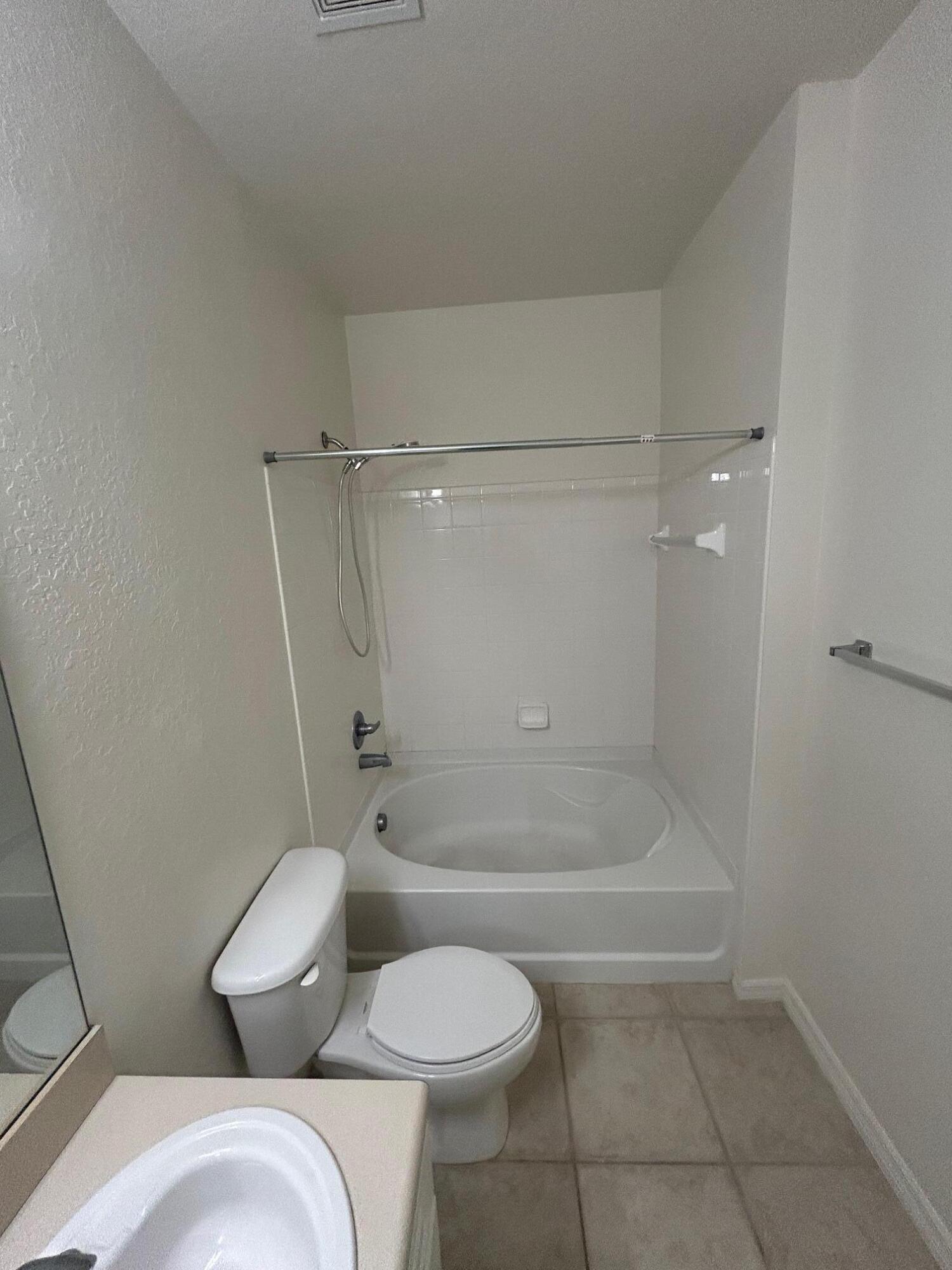 272 Southeast Kitching Circle Stuart, FL 34994 - Photo 12 of 23 a bathroom with a toilet and shower