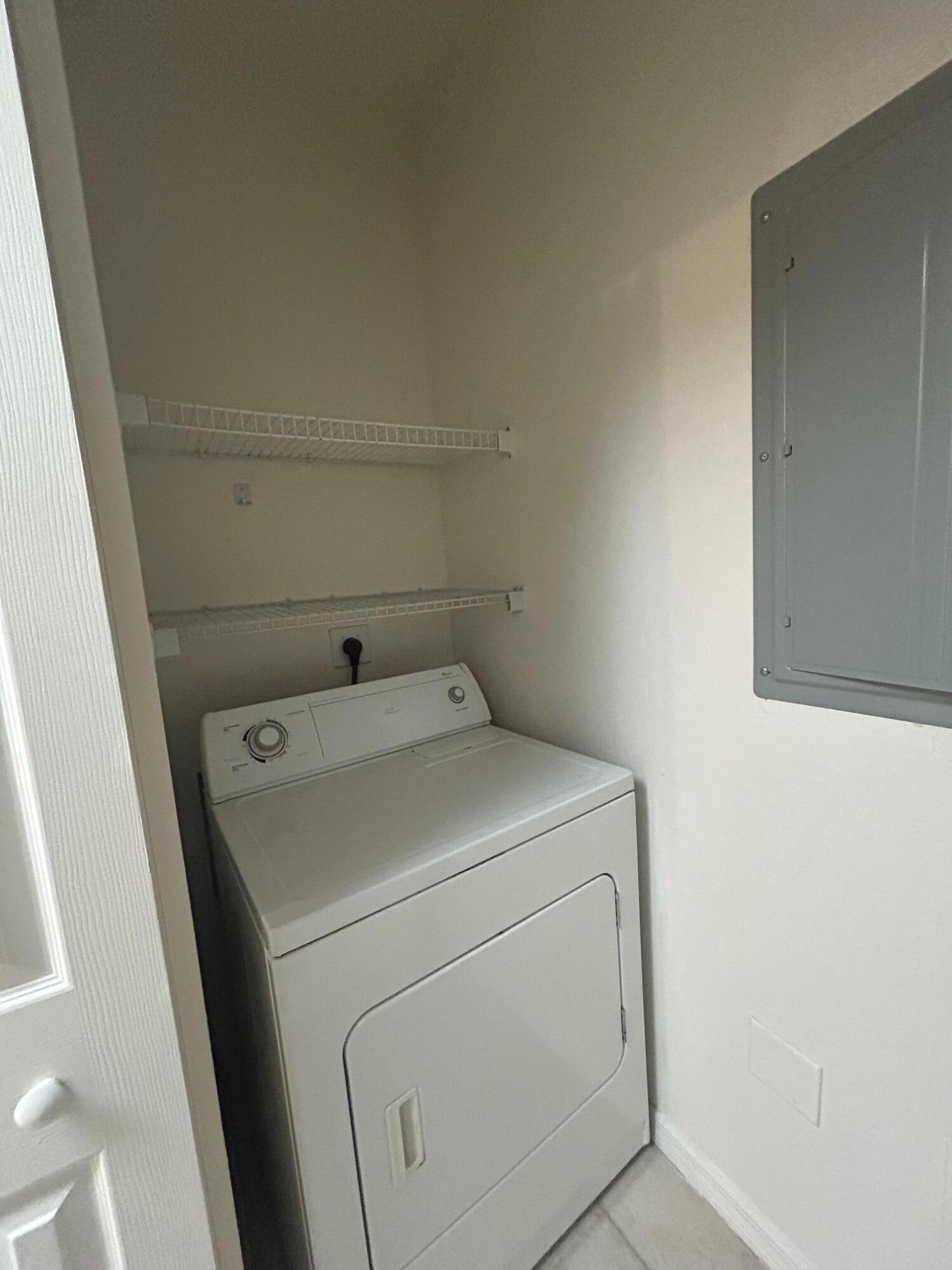 272 Southeast Kitching Circle Stuart, FL 34994 - Photo 18 of 23 a utility room with dryer and washer