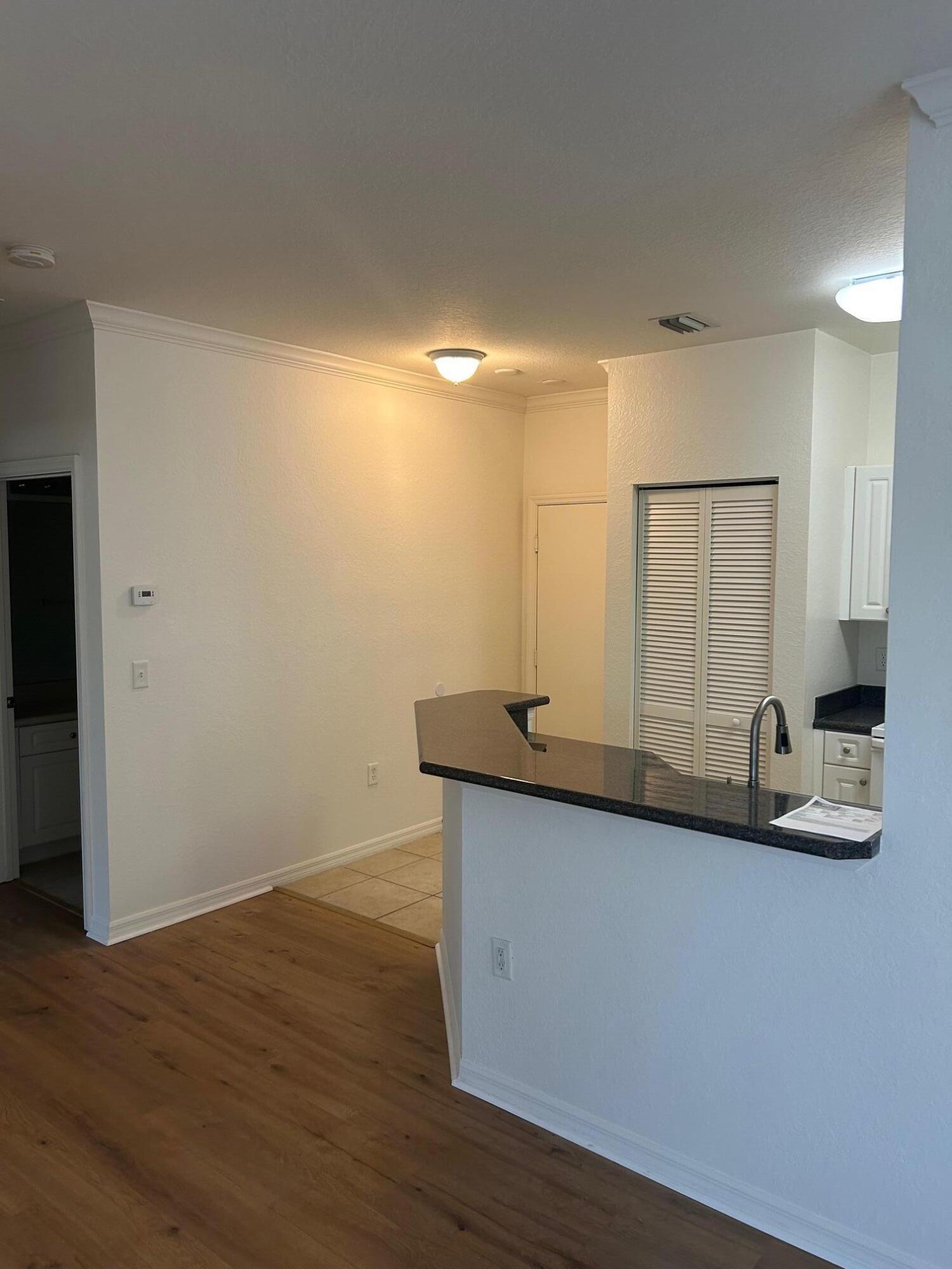 272 Southeast Kitching Circle Stuart, FL 34994 - Photo 23 of 23 a bathroom with a granite countertop sink and a mirror
