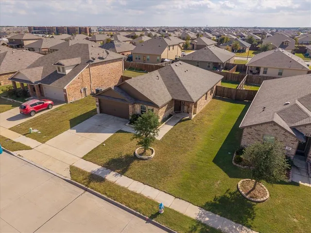 an aerial view of a house with a ocean view
