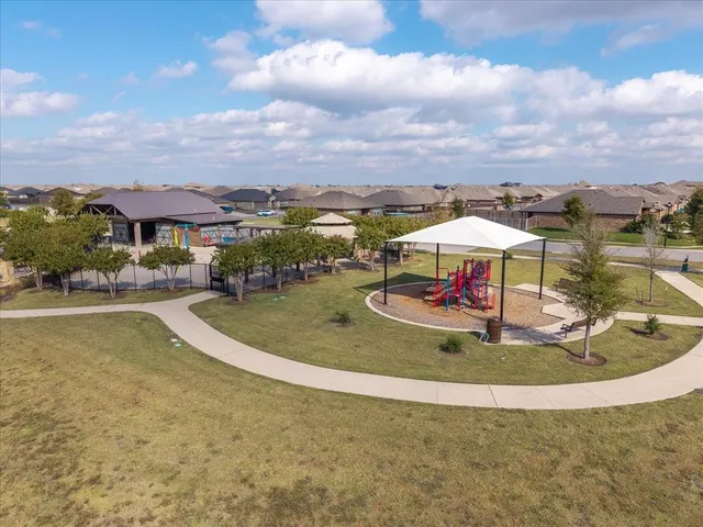 a view of a swimming pool with a yard