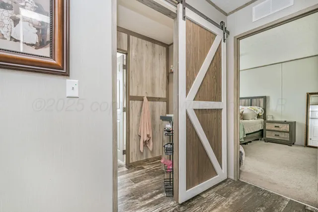 a view of a hallway view with staircase