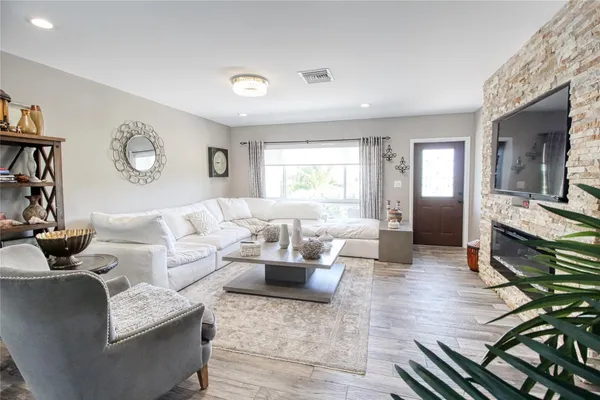 a view of a backyard with swimming pool