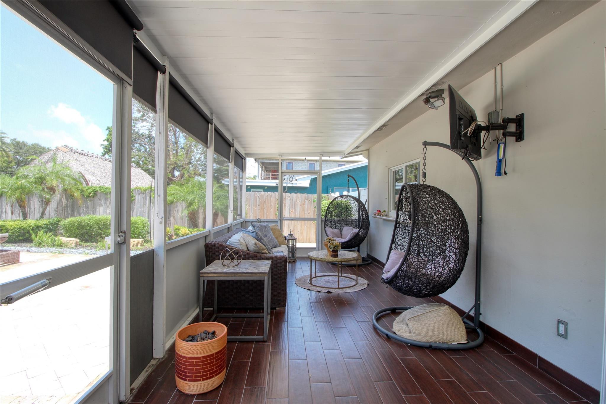 2080 Northeast 26th Street Lighthouse Point, FL 33064 - Photo 18 of 27 a living room with furniture and a floor to ceiling window