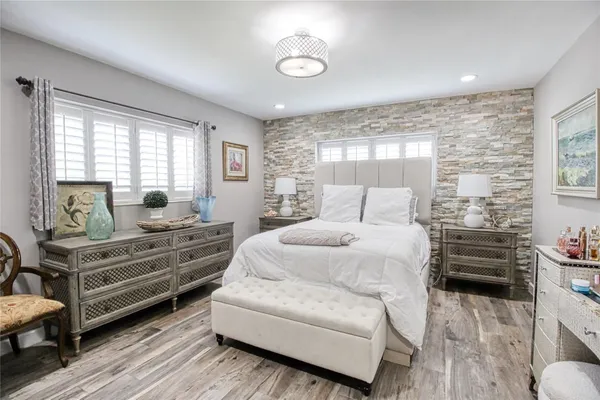 a bedroom with a bed and a dresser