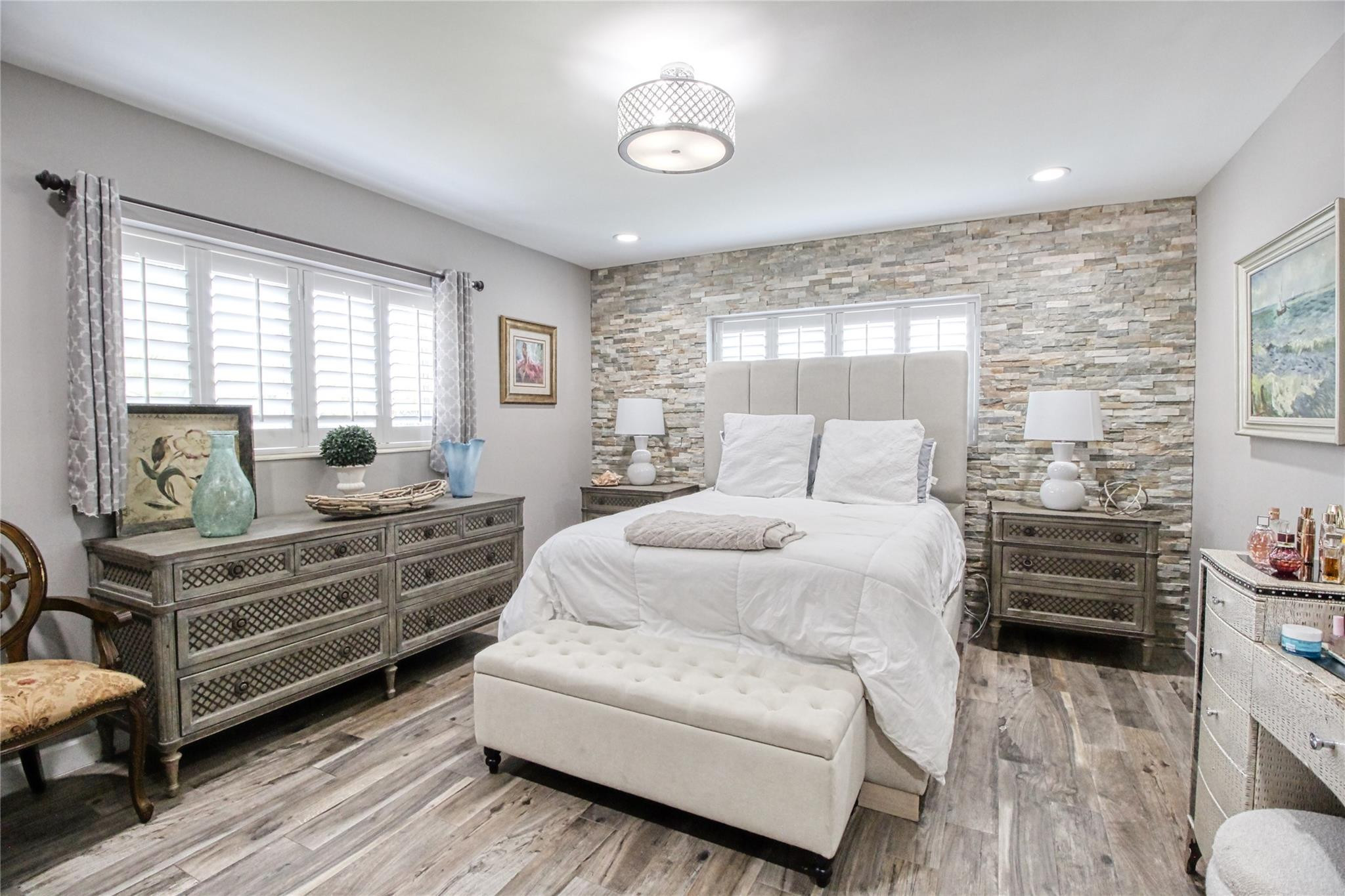 2080 Northeast 26th Street Lighthouse Point, FL 33064 - Photo 19 of 27 a bedroom with furniture and wooden floor
