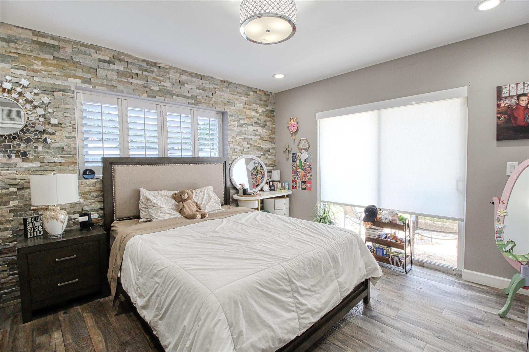 2080 Northeast 26th Street Lighthouse Point, FL 33064 - Photo 23 of 27 a bedroom with a bed and a table