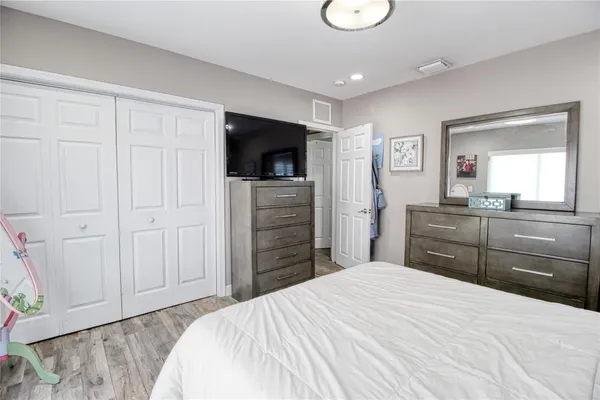 a bathroom with a sink a toilet and potted