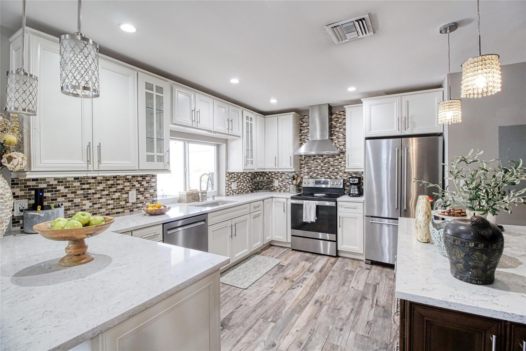 2080 Northeast 26th Street Lighthouse Point, FL 33064 - Photo 6 of 27 a kitchen with refrigerator and cabinets